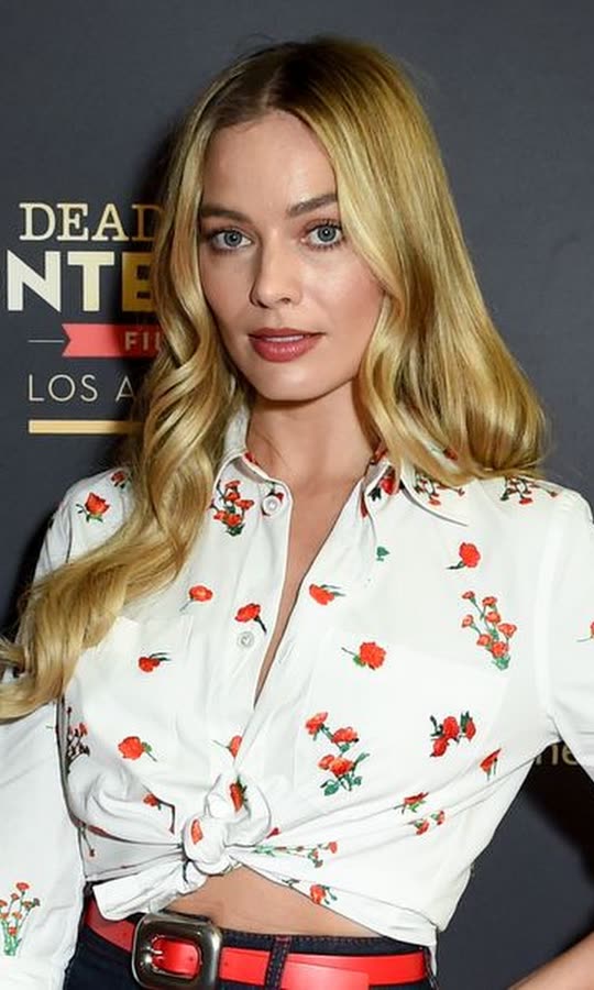 Margot Robbie Is a ‘40s Pin-Up Barbie in a Tie Top and...
